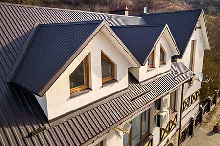 House with standing seam metal roof